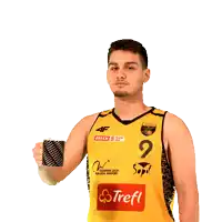 a man wearing a yellow shirt with the number 2 on it