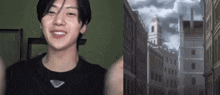 a young man in a black shirt is smiling in front of a cityscape .