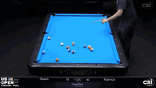 a pool table with a blue cloth that says diamond