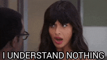 a woman with a surprised look on her face is standing next to a man and says `` i understand nothing '' .