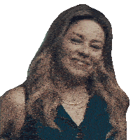 a woman wearing a blue shirt and a gold necklace smiles for the camera