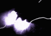 a person 's face is silhouetted against a purple lightning bolt