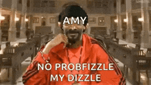snoop dogg is wearing a red jacket with the words `` amy no probfizzle my dizzle '' on it .