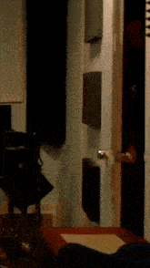 a person standing in front of a door that has a triangle on it
