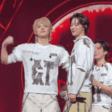 a man wearing a white shirt that says gt