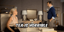 a woman sits at a desk talking to a man with the words tea is horrible above them