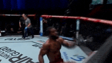 a man in a boxing ring with the number 9 on the ground