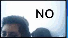a blurred image of a man and a dog with the word no in the corner