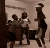 a group of people are standing in a room and fighting