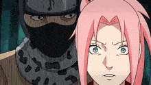 a girl with pink hair is standing next to a man with a mask on his face