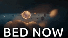 a person is holding a planet in their hand with the words bed now written on it .