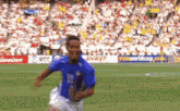 a soccer player is running on a field with a fifa world cup ad in the background