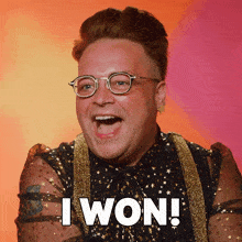 a man wearing glasses and a shirt that says " i won "