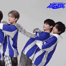a group of young men are hugging each other with the words kteam 3rd anniversary on the bottom right