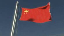 a red flag with a hammer and sickle and the letters p.c.i.