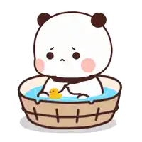 a panda bear is taking a bath in a bucket with a yellow rubber duck .