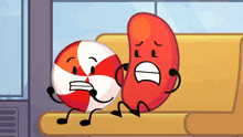 a red bean and a red and white ball are sitting next to each other