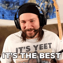 a man wearing headphones and a t-shirt that says it 's yeet