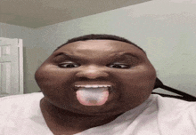 a man making a funny face sticking his tongue out
