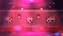 a blurred image of a stage with a few people dancing on it