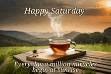a cup of tea sits on a wooden table with the caption happy saturday