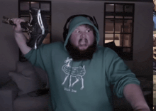 a man with a beard wearing a dill doe sweatshirt