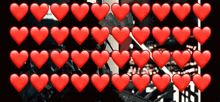 a row of red hearts with a black background