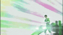 a man in a green suit is fighting a green vehicle .