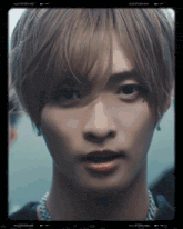 a close up of a young man 's face with the words vllo studio 400 on the bottom