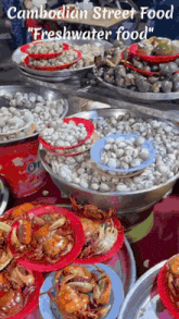 a variety of seafood is displayed at a cambodian street food freshwater food