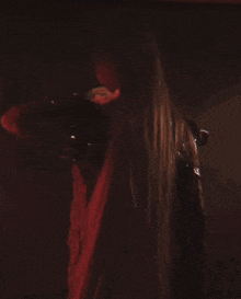 a woman with long hair and a nose ring is dancing