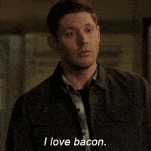 a man in a jacket says " i love bacon " on the screen