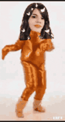 a cartoon of a girl in an orange suit dancing .