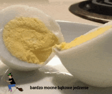 a picture of hard boiled eggs with a witch on a broom and the words bardzo mocne bakowe jedzenie