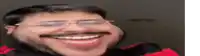 a man with glasses and a mustache is smiling .