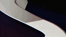 a close up of a staircase with a black and white swirl