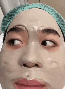 a close up of a person 's face with a mask on .