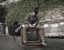 Sitting On Tv Chilling GIF - Sitting On Tv Chilling Relaxing GIFs