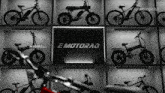 a display of e motorrad bikes on a wall