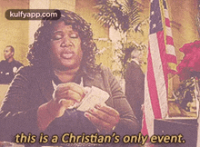 a woman is holding a bunch of money in her hands and says `` this is a christian 's only event . ''