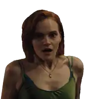 a woman wearing a green tank top and a necklace looks surprised