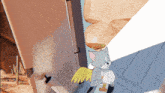 a cartoon of a cat with wings and a halo on his head with the letter t on his chest