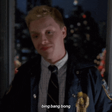 a man in a suit and tie with the words bing bang bong below him