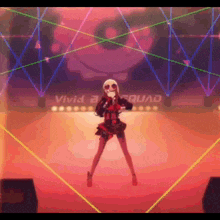 a woman in a skull mask is dancing on a stage with a sign that says vivid squad in the background