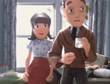 a man and a woman are standing next to each other in a room