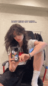 a woman taking a picture of herself with the words baby read my mind