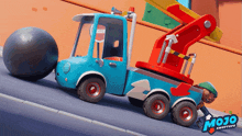 a blue toy tow truck with mojo shoptops written on it