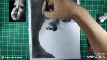 a drawing of a baby 's face is being made in animatica