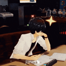 a person sitting at a desk with the word junes written on the bottom