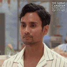 a man is on the great canadian baking show looking at the camera